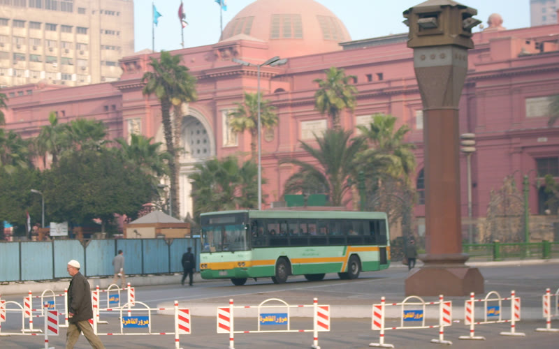 Pink neoclassical facade of the Egyptian Museum facing its garden in central Cairo